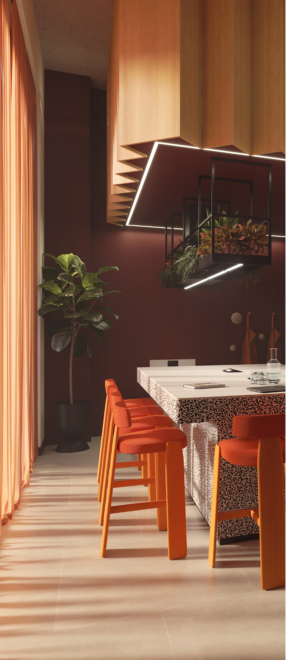 Modern kitchen in student accommodation in Birmingham, featuring orange stools at a white island with a patterned front, overhead wooden cabinets, an indoor plant, and large windows with sheer orange curtains letting in sunlight.