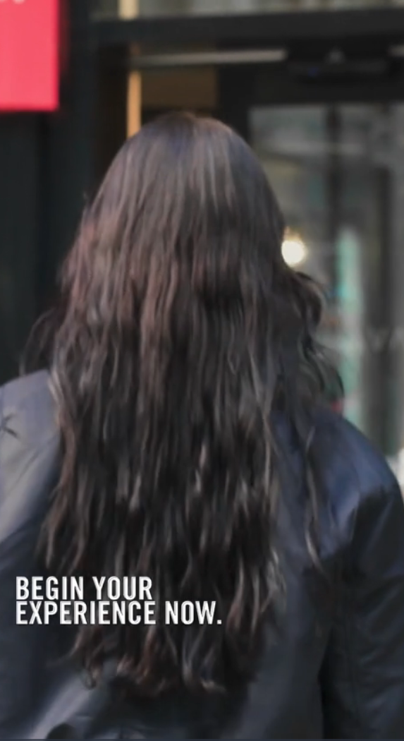 Video thumbnail of the back of a girls head as she's walking into a Vita Student building.