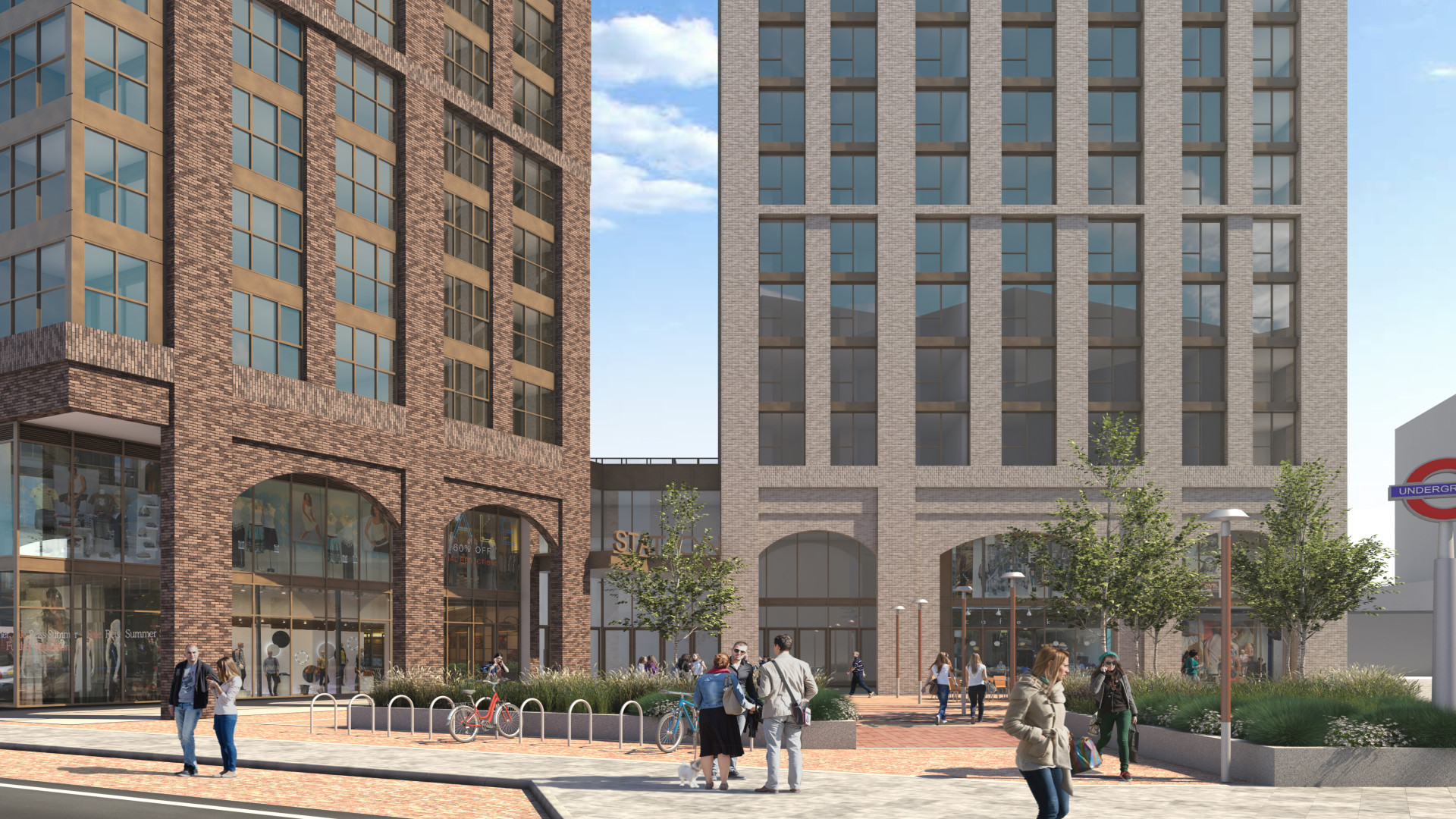 Street view of two tall modern buildings with large windows in London. People meander along a brick-paved path adorned with small trees and bike racks. A Vita Student sign accompanies the subway entrance on the right side near one of the sleek structures.