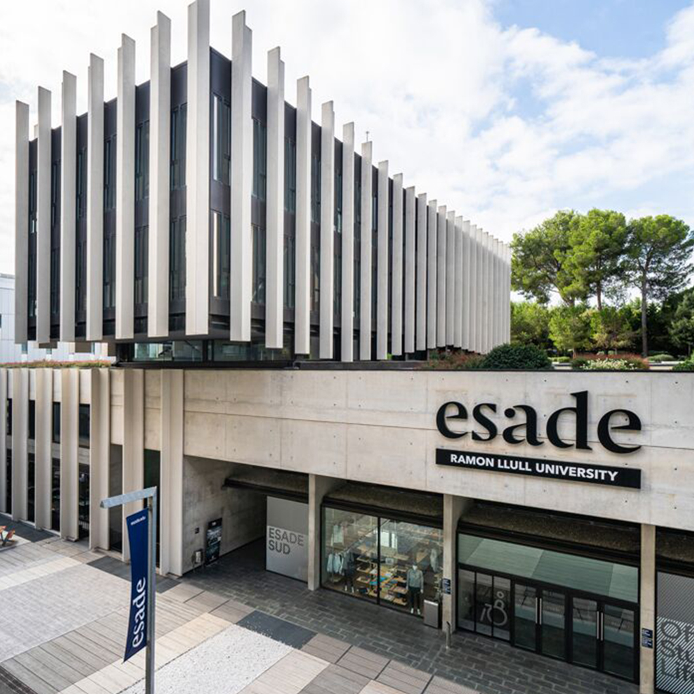 The esade university building is on the corner of a street.