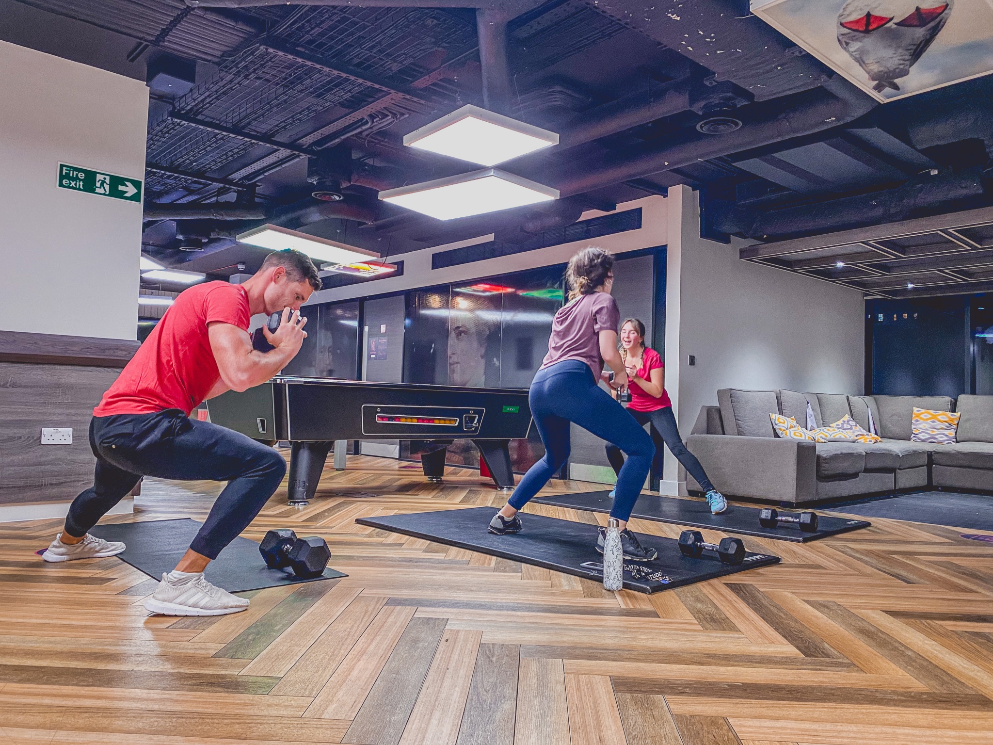 A group of people working out in Vita Student's communal area.