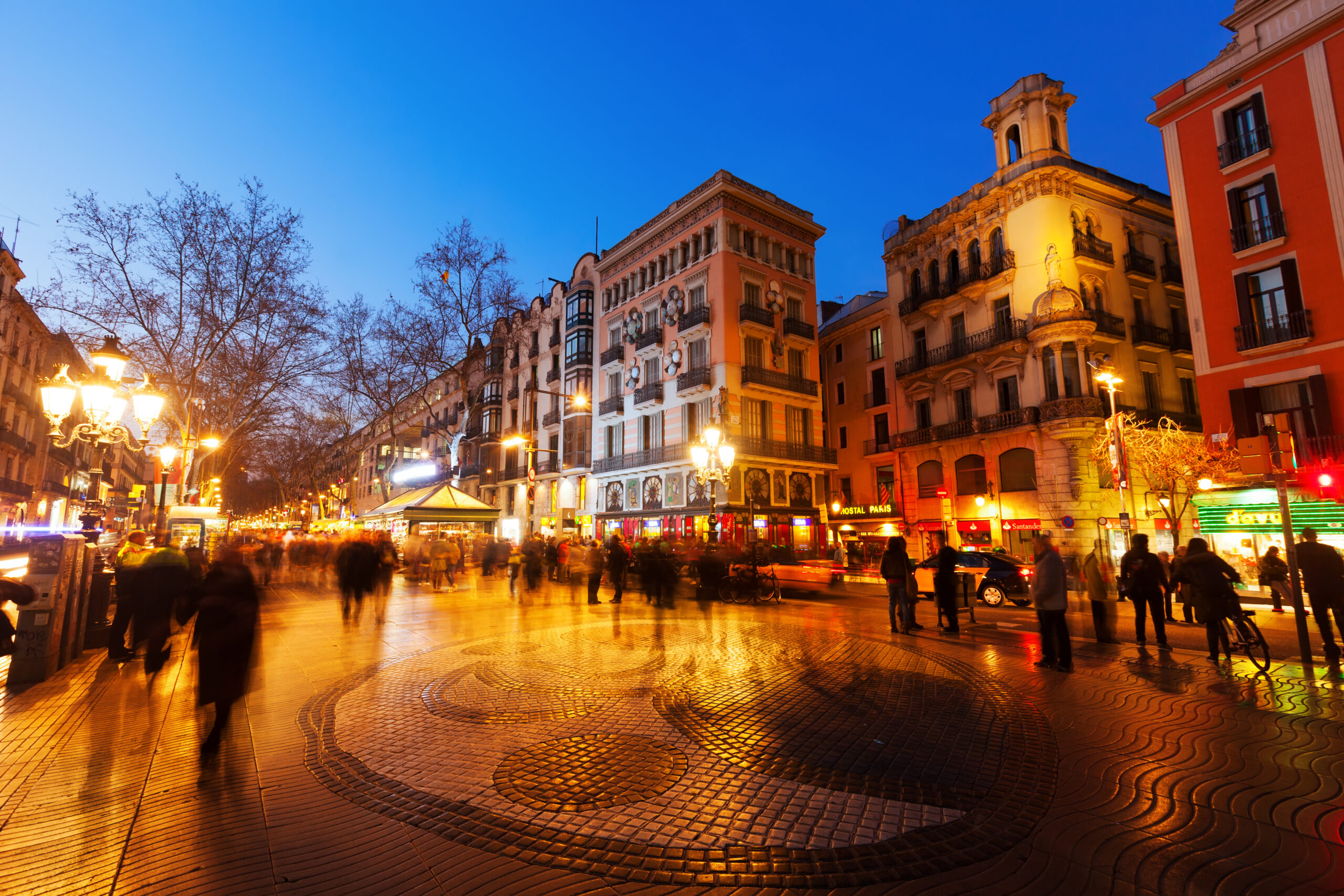 Bustling city lit up at night time.