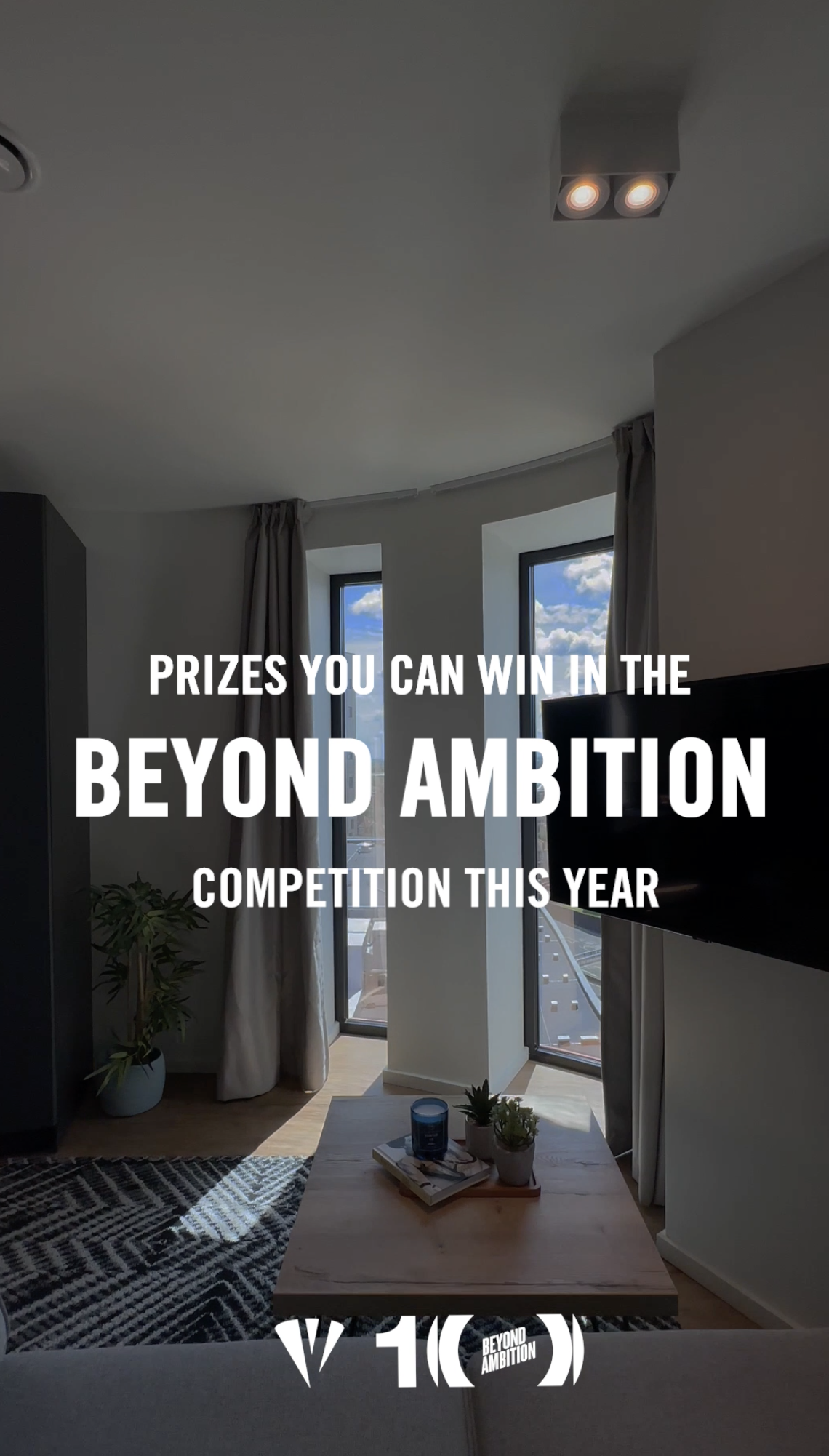 A modern living room features a large TV on the wall and two tall windows inviting natural light. Text over the image reads, "Prizes you can win in this year's Beyond Ambition competition.