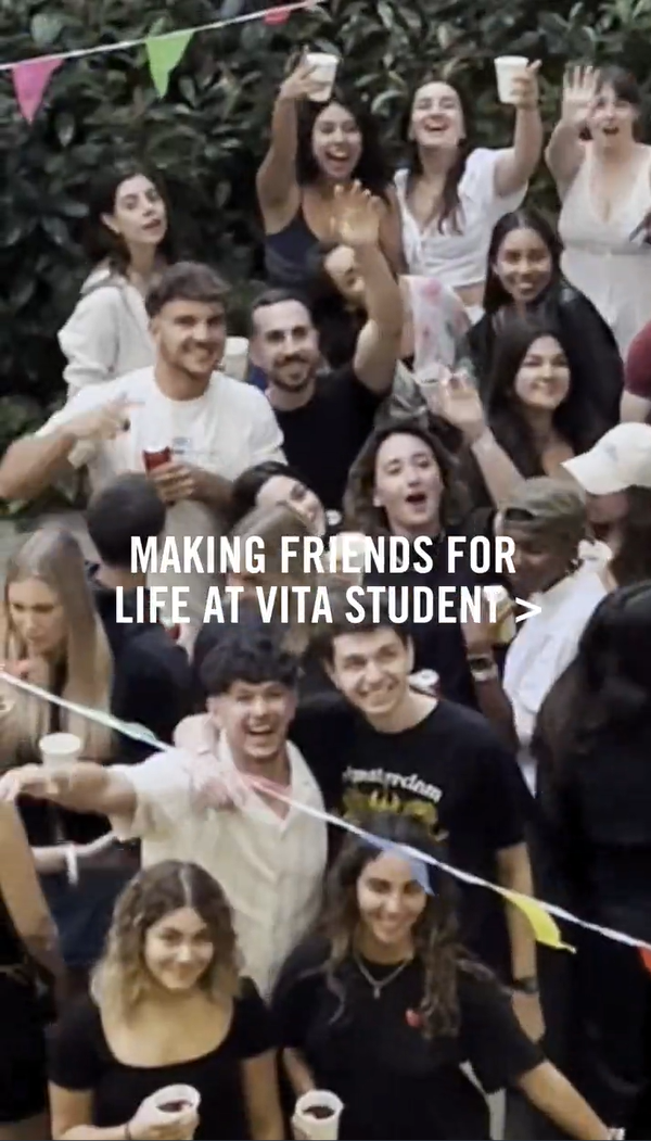 A group of smiling young adults gather at an outdoor event, some holding drinks. Colorful bunting decorates the area. Text on the image reads, "MAKING FRIENDS FOR LIFE AT VITA STUDENT >". The background features leafy greenery.