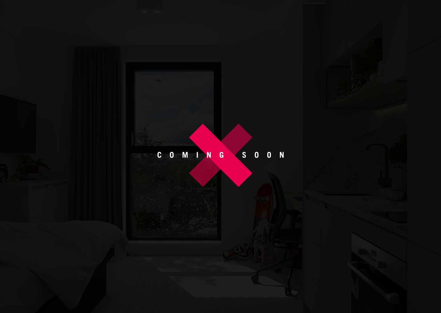 A dimly lit room with a bed and a chair near a window. The phrase "COMING SOON" is encircled by the distinctive graphic of a red 'X,' hinting at future tension in this confined space.