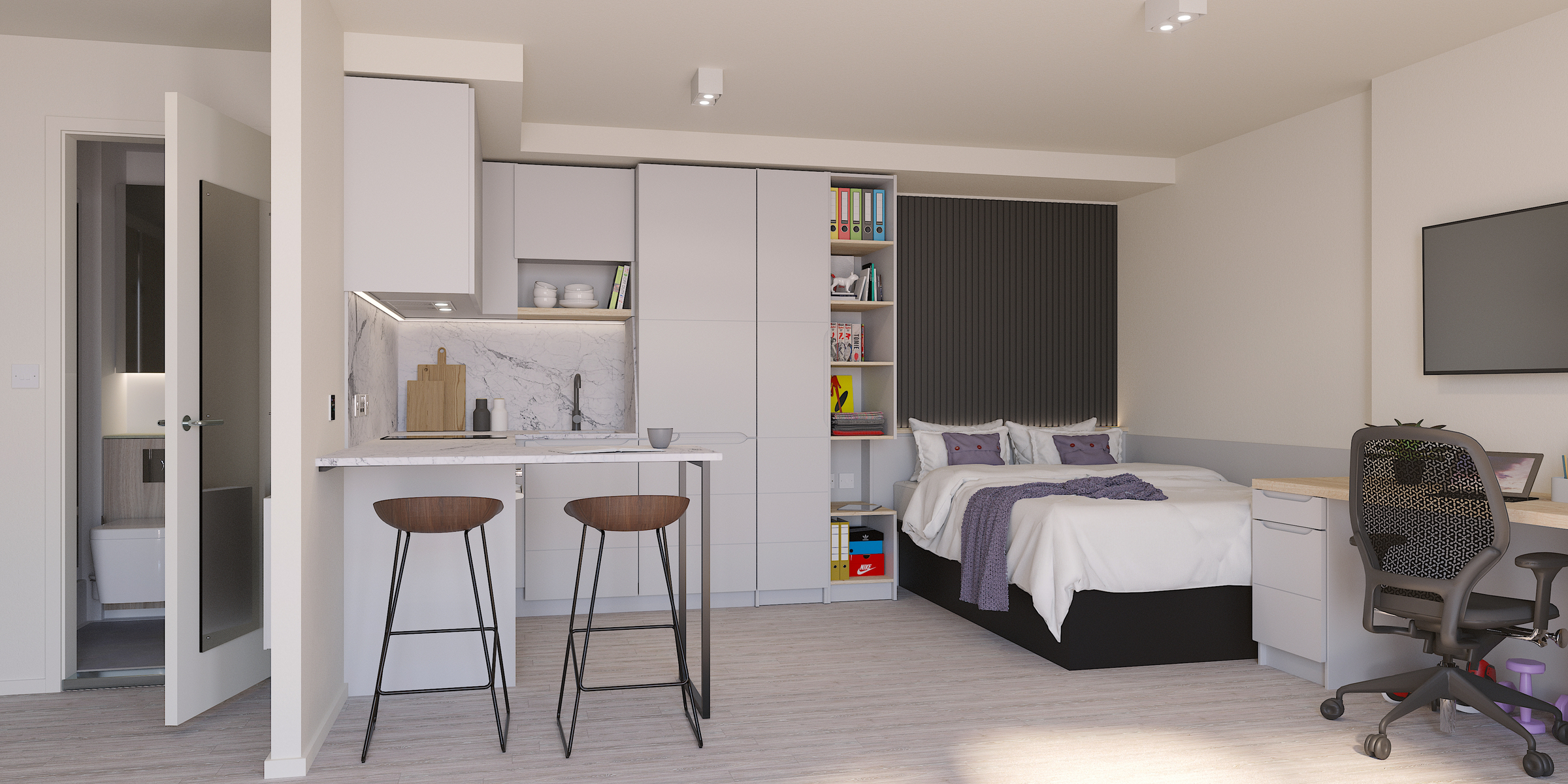Modern Gough Street studio apartment with a small kitchen, two bar stools, bed with cushions, bookshelves, desk with chair, and wall-mounted TV; bright, uncluttered, and neutral-toned decor.