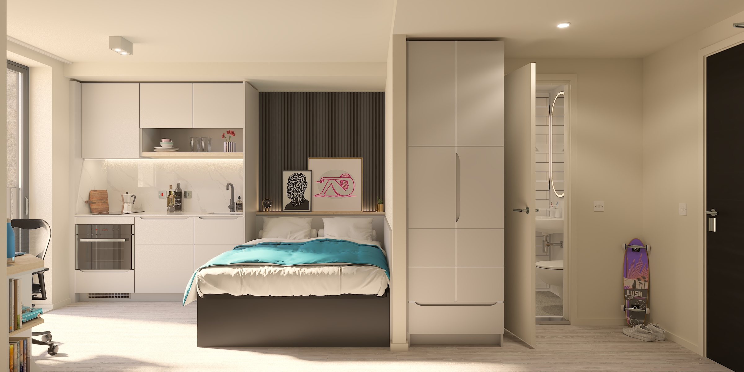 A modern studio apartment in New Waverley features a bed with teal bedding, a kitchenette with built-in appliances, a bathroom, a skateboard by the door, and a desk near a large window letting in natural light.