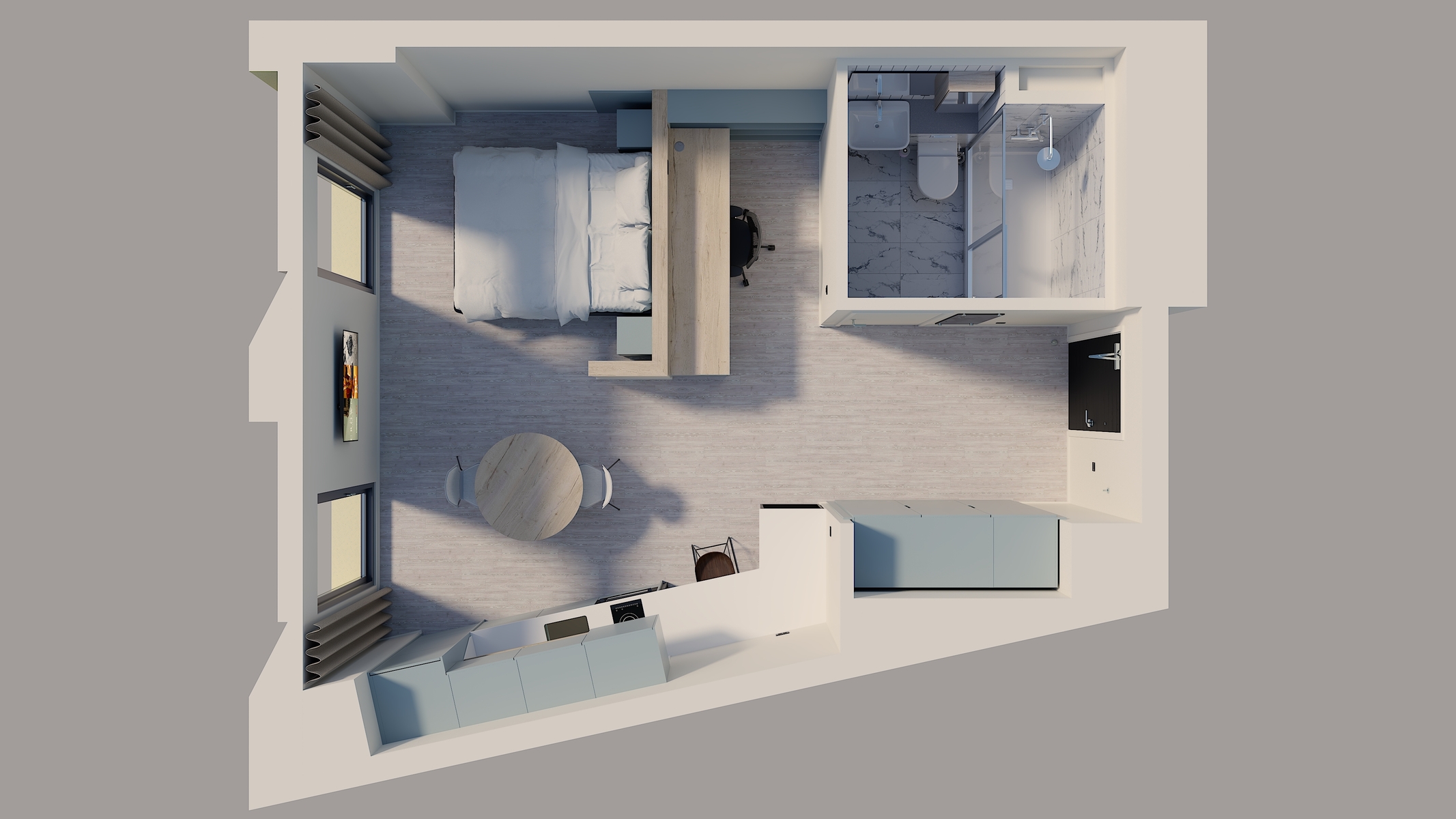 A top-down view of a modern studio apartment with a bed, dining table, kitchen area, and bathroom. The space features light-colored flooring and cabinets, with natural light coming from large windows.