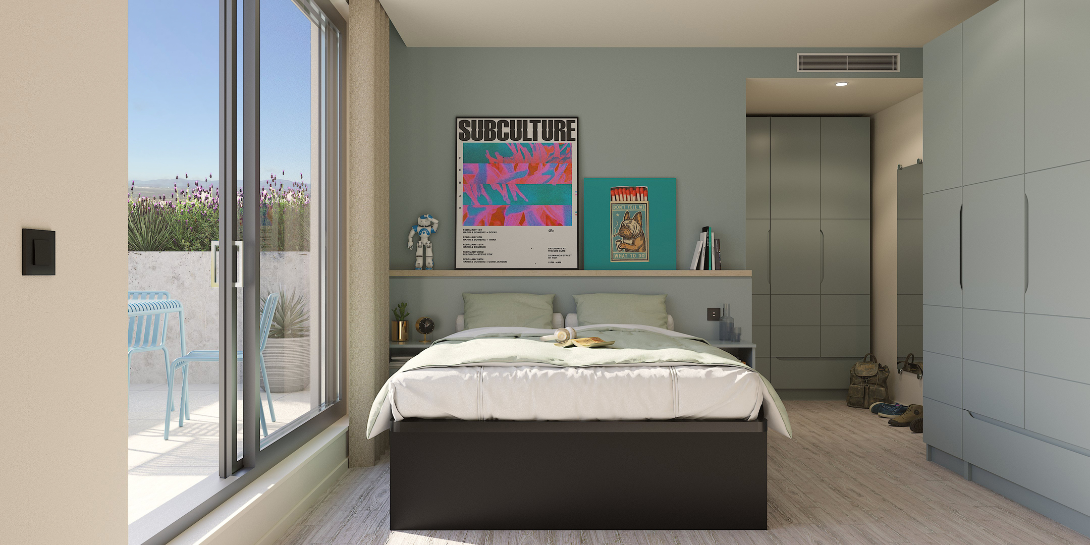A modern bedroom with a large window, double bed, light blue walls, colorful posters above the bed, built-in wardrobes, and a patio with outdoor seating and plants visible outside.