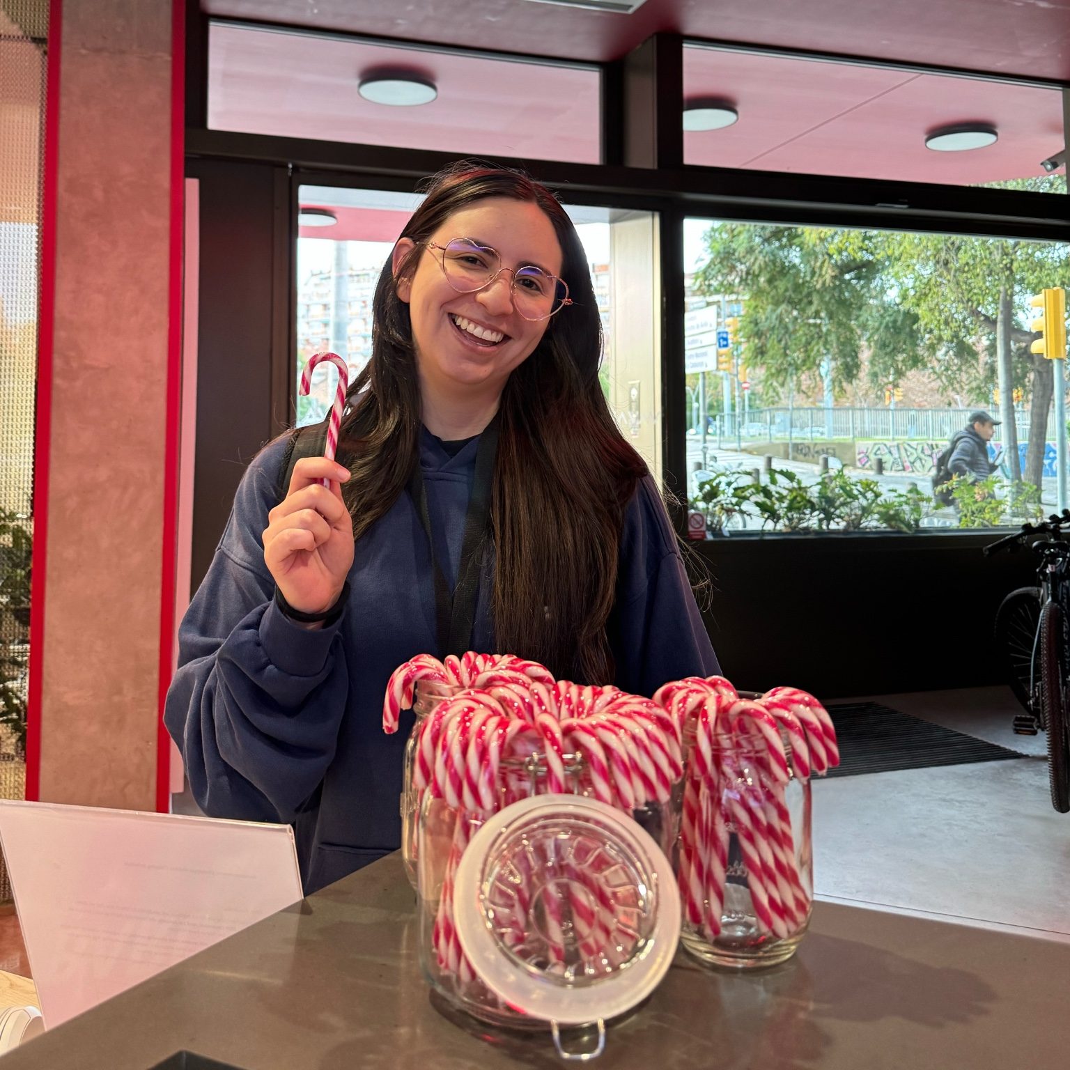 Vita Student resident with candy canes celebrating festive traditions