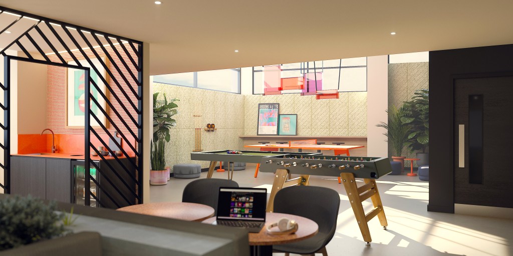 A modern game room in Madrid with a foosball table, cozy seating, colorful wall art, potted plants, and bright natural lighting from large windows—an ideal spot for IE students seeking where to live and study comfortably.