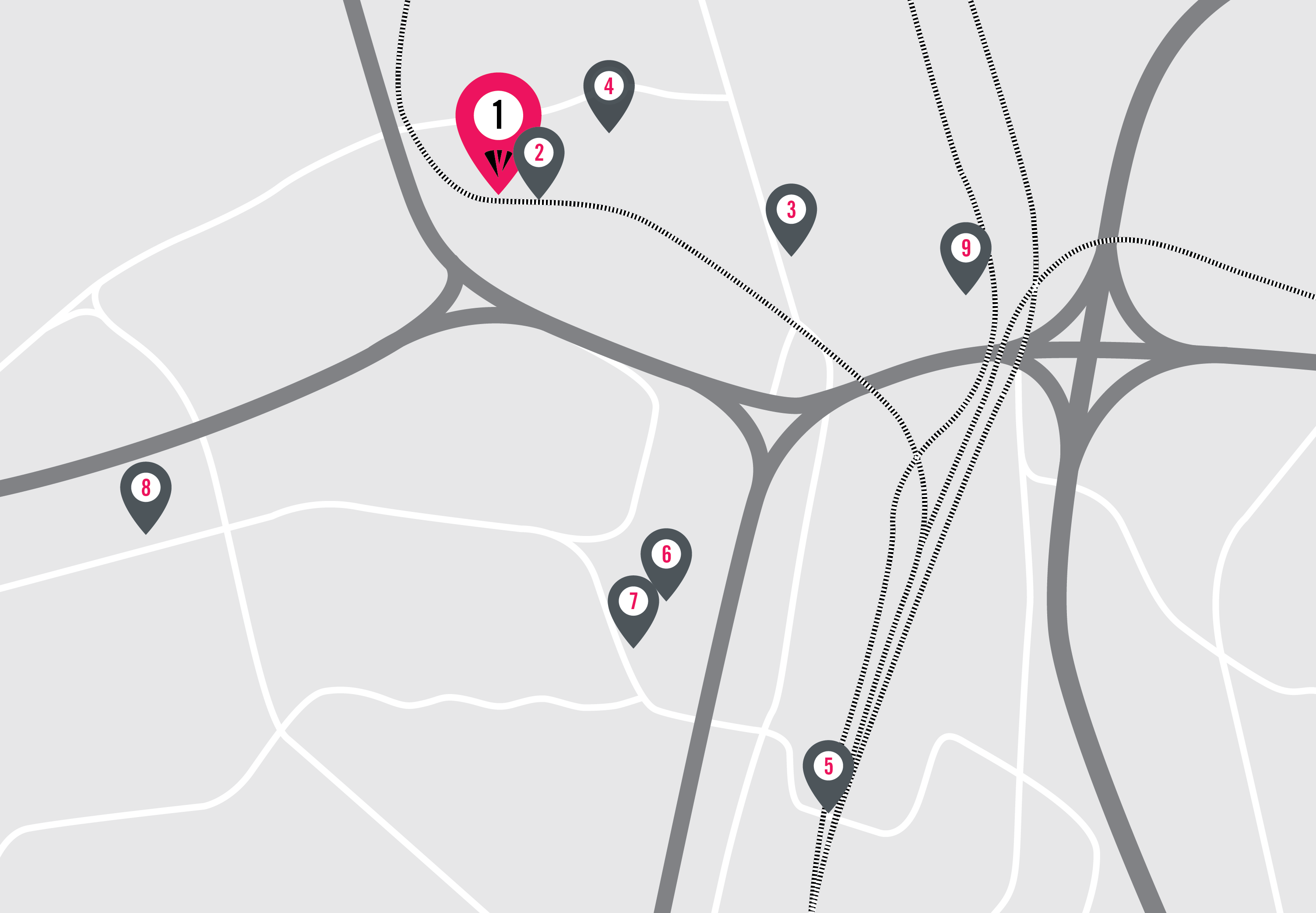 A simplified map with gray roads and rail lines, showing ten numbered location markers—including IE University Student Residences—marker 1 highlighted in pink; the markers are spread across the map near intersections and highways.